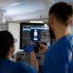 icu nurses operating a dialysis machine in intensive care