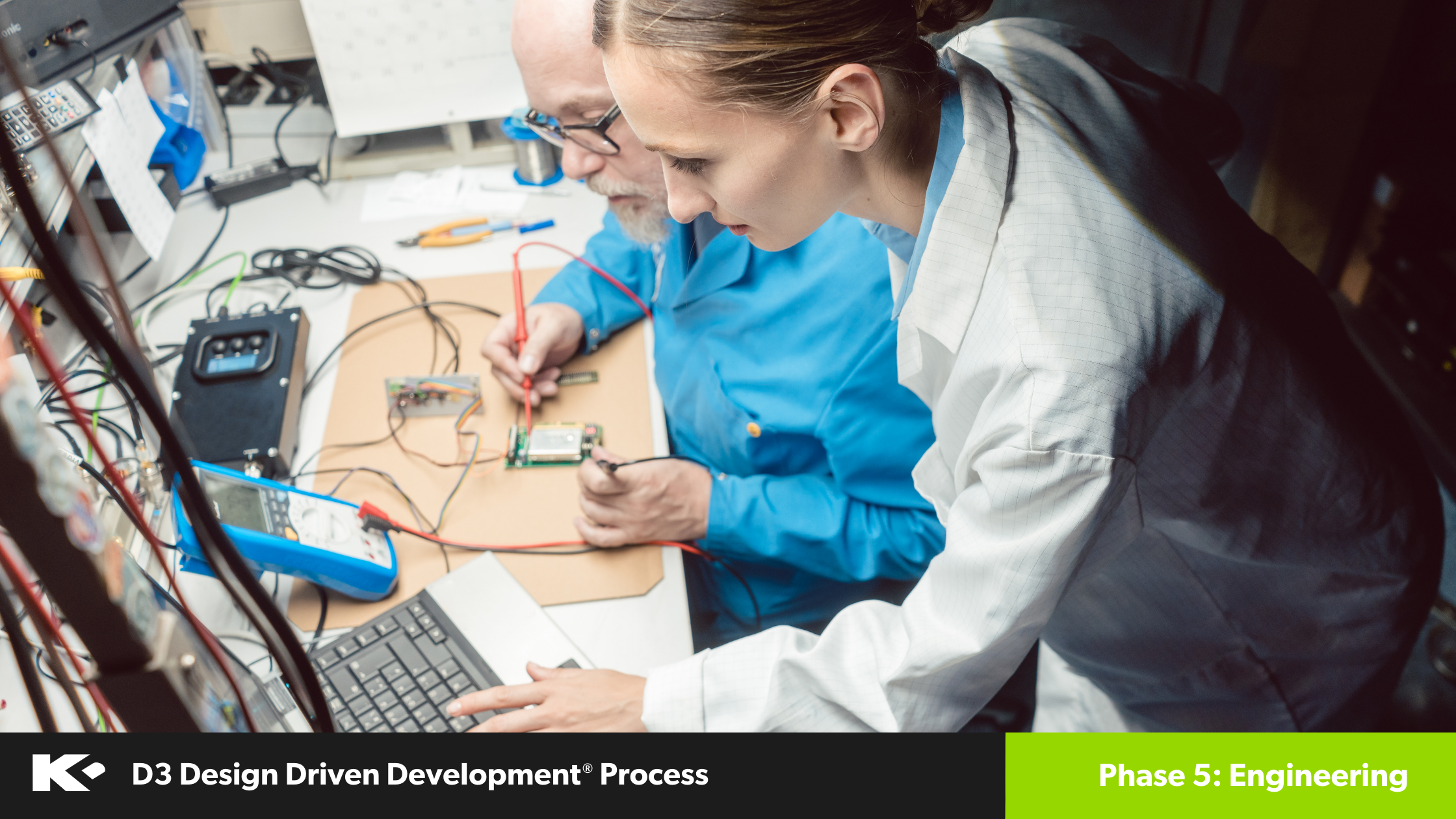 A woman in a lab coat and a man work together on electronic circuits at a desk, using a laptop and testing equipment. Text at the bottom reads "D3 Design Driven Development® Process - Phase 5: Engineering.