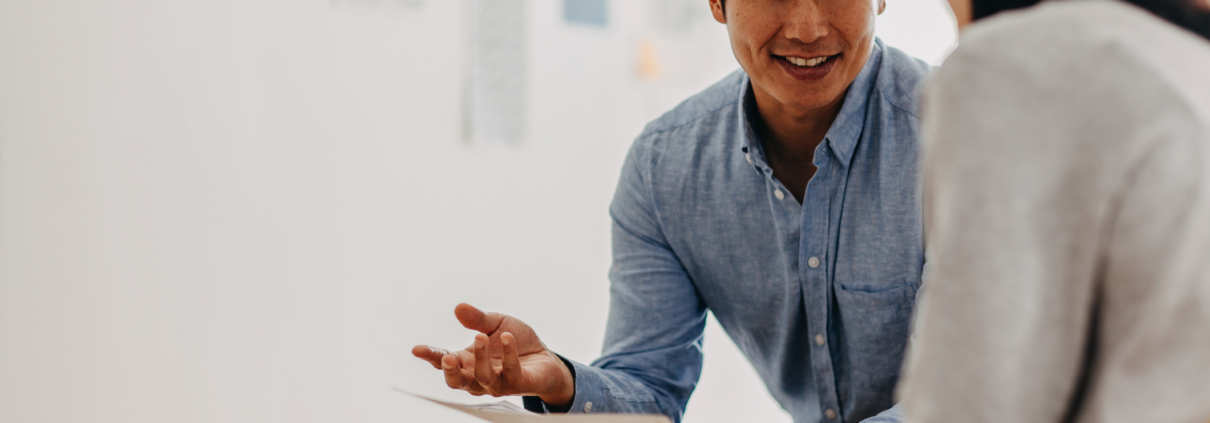 Korean architect talking at meeting in modern office studio