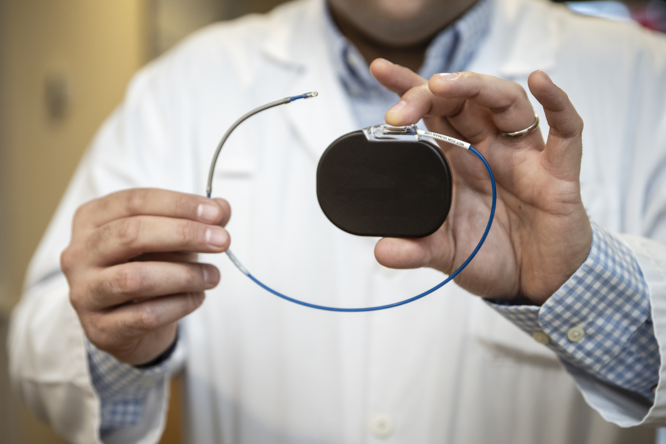 a doctor shows a pacemaker